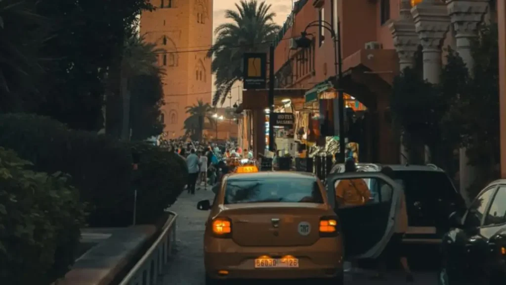 Red petit taxi on a street in a Moroccan city