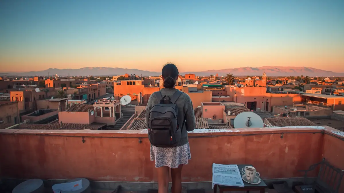 Rooftop view over a Marrakech medina with mint tea and a map for a Morocco travel guide