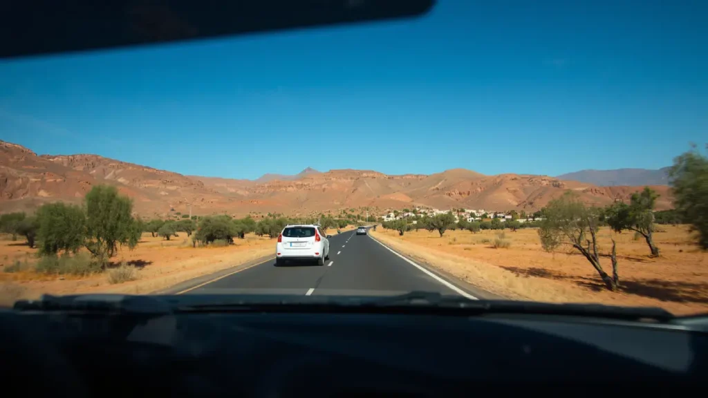 Car driving on a rural Moroccan road between Marrakech and Ouzoud Falls