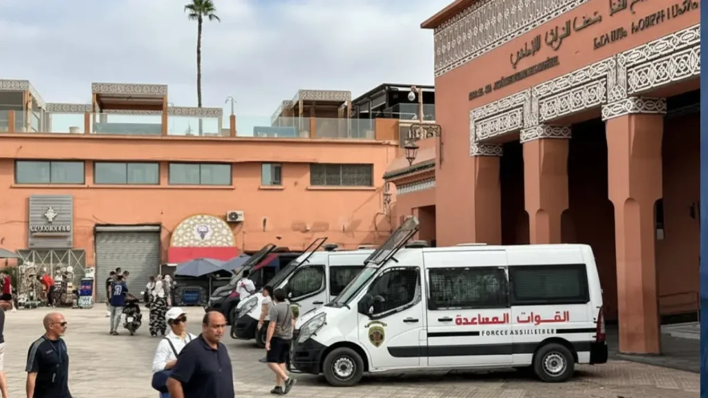 Police car parked near a public square in Morocco