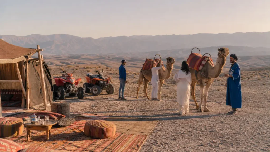 Travelers combining quad biking and camel riding in Agafay Desert