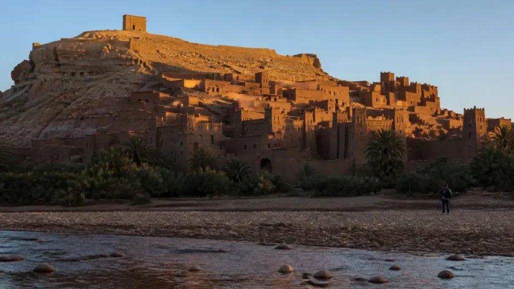 Sunrise light illuminating the earthen towers of Aït Ben Haddou