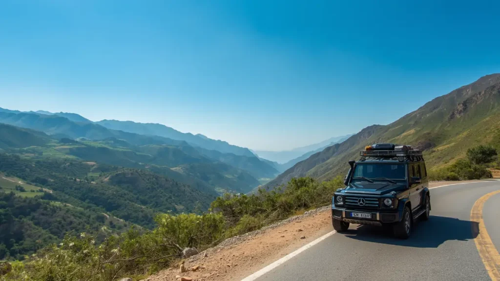 Winding mountain road through the green Rif Mountains in northern Morocco, highlighting the driving route between Fez and Chefchaouen.