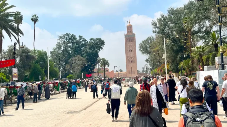 Koutoubia Mosque and visitors exploring Marrakech during a 3 day itinerary