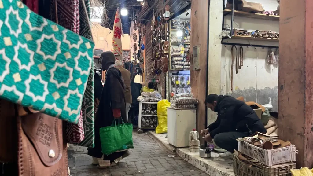 Craftsman making leather babouches in Souk Smata, Marrakech