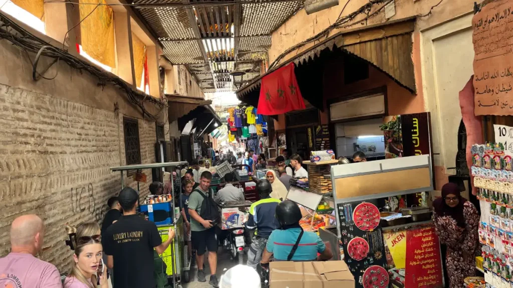 Crowded shopping street deep inside the Marrakech Medina