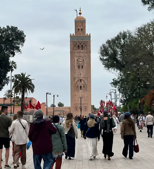 Visitors walking toward the Koutoubia Mosque in Marrakech