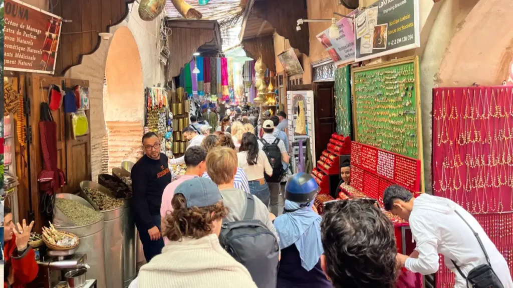 Visitors exploring the busy Marrakech souks during their first day