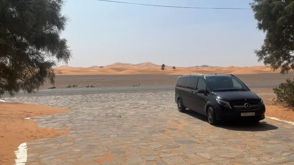 Vehicle beside the Erg Chebbi dunes near Merzouga on a 3 day Morocco itinerary