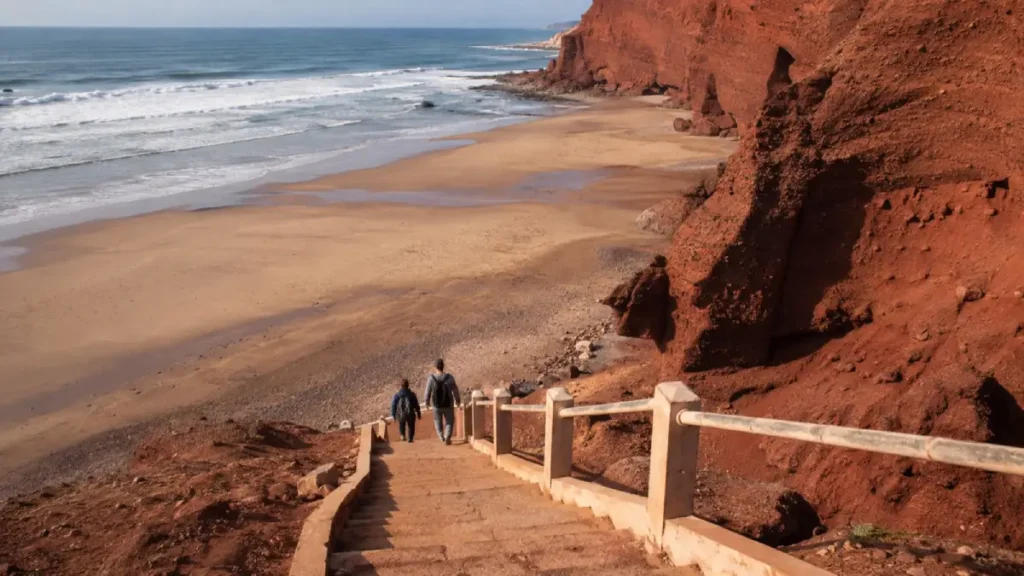 Steep stairs descending the red cliffs to Legzira Beach