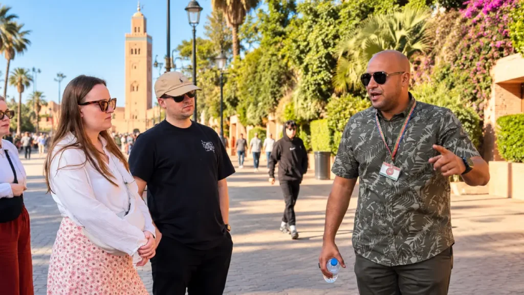 Licensed Marrakech tour guide Youness explaining the city to visitors near Koutoubia