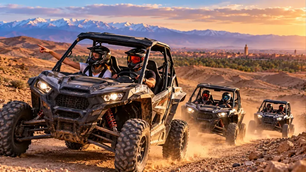 Travelers driving off-road buggies in Agafay near Marrakech with the Atlas Mountains in the background