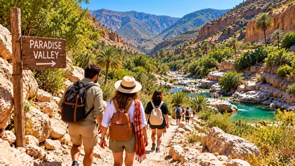 Travelers walking down the rocky trail toward the natural pools in Paradise Valley near Agadir
