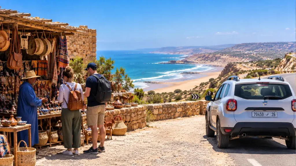 Travelers stopping at a coastal viewpoint between Agadir and Essaouira with Atlantic Ocean views