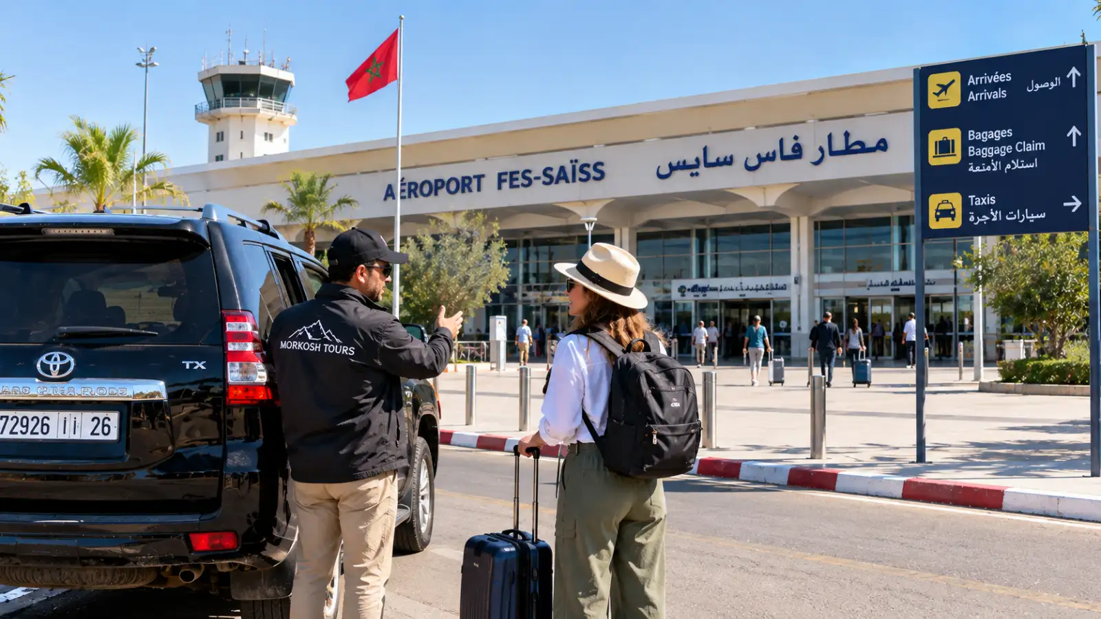Private Fes airport transfer with Moroccan driver welcoming a traveler beside a black Toyota Prado TX at Fes–Saïss Airport