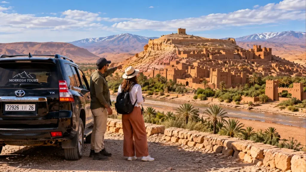 Private Fes desert tour with black Toyota Prado TX, Moroccan driver and traveler overlooking Ait Benhaddou on the way to Marrakech