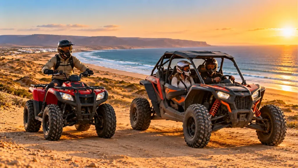 Quad bike and dune buggy on sandy coastal terrain near Agadir at sunset